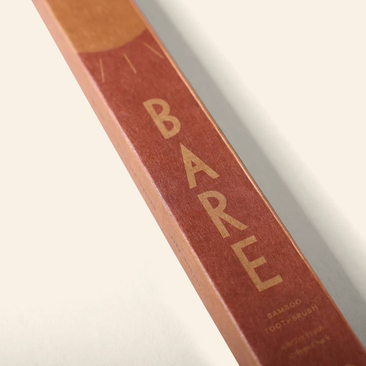 The sun graphic on the BARE kraft pack, up close