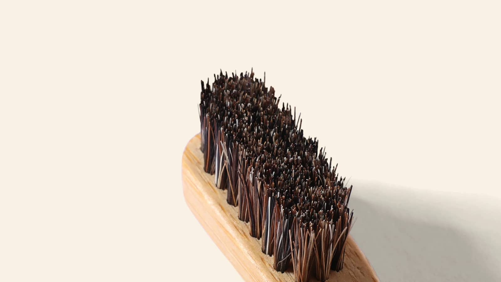 Horse hair tufts woven into the bamboo head of the BARE toothbrush
