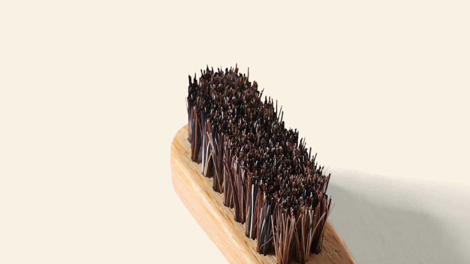 Horse hair tufts woven into the bamboo head of the BARE toothbrush.